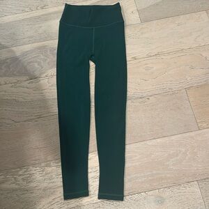 Athleta green leggings with small cutout details!